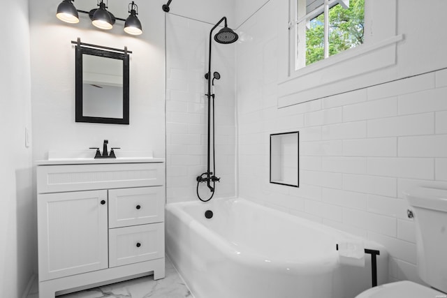 bathroom featuring vanity, marble finish floor, toilet, and shower / bathing tub combination