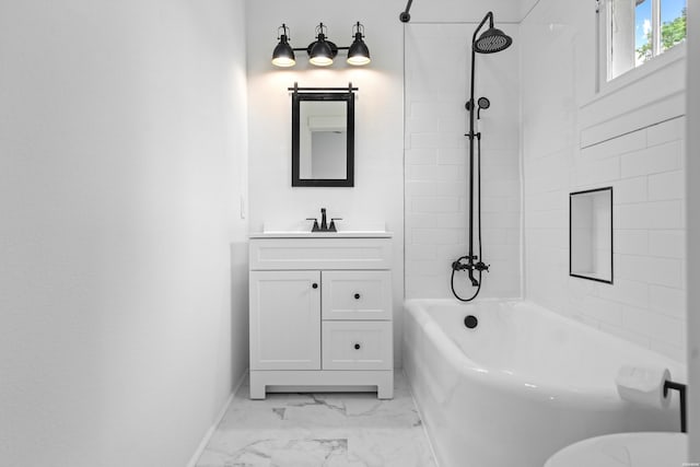 full bath featuring baseboards, vanity, bathing tub / shower combination, and marble finish floor