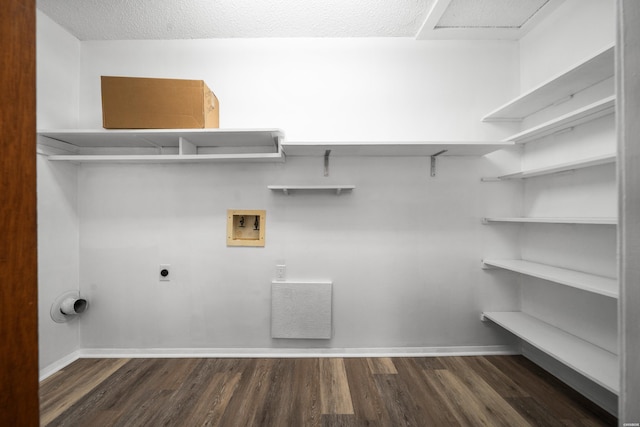 laundry room featuring laundry area, hookup for a washing machine, dark wood-style floors, and electric dryer hookup