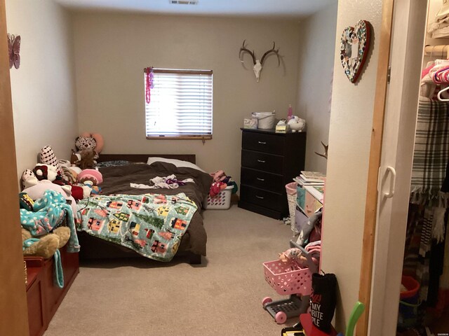 carpeted bedroom with visible vents