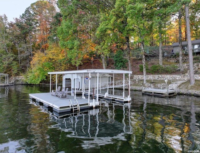 dock area featuring a water view and boat lift