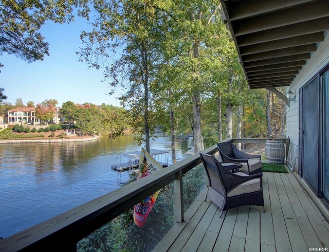 wooden deck featuring a water view