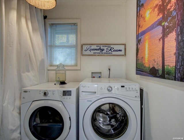 washroom featuring laundry area and washing machine and dryer