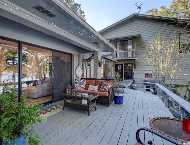 deck featuring outdoor lounge area