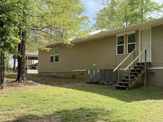 5301 Owensville Cutoff Cutoff, Lonsdale, AR 72087 - rear view of house with central air condition unit, entry steps, a yard, and crawl space