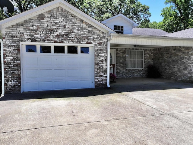 view of front of house with concrete driveway and an attached garage