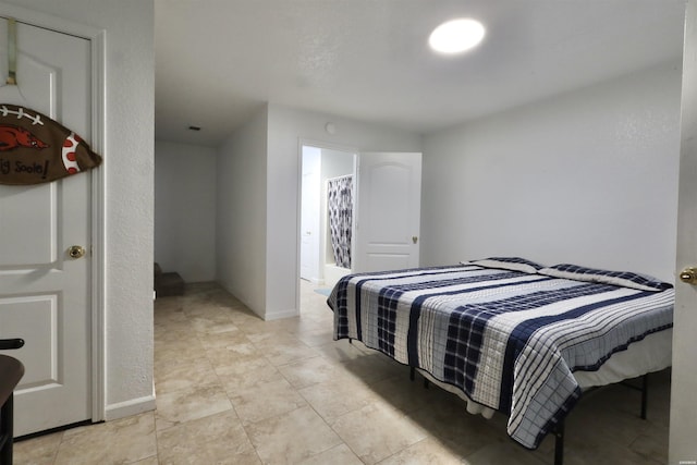 bedroom featuring baseboards