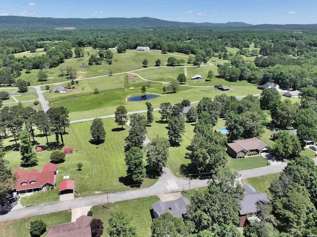 aerial view featuring a mountain view and a forest view