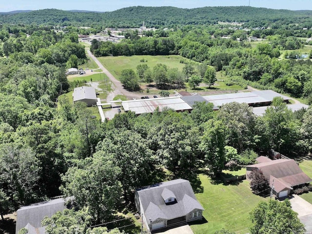 aerial view featuring a wooded view