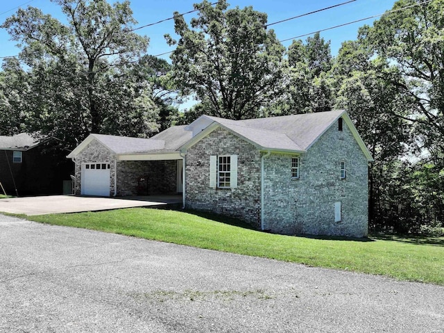 single story home featuring a garage, brick siding, concrete driveway, and a front lawn