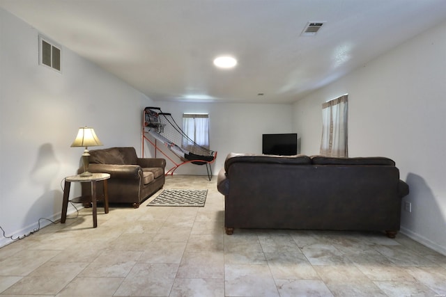 living room with visible vents and baseboards