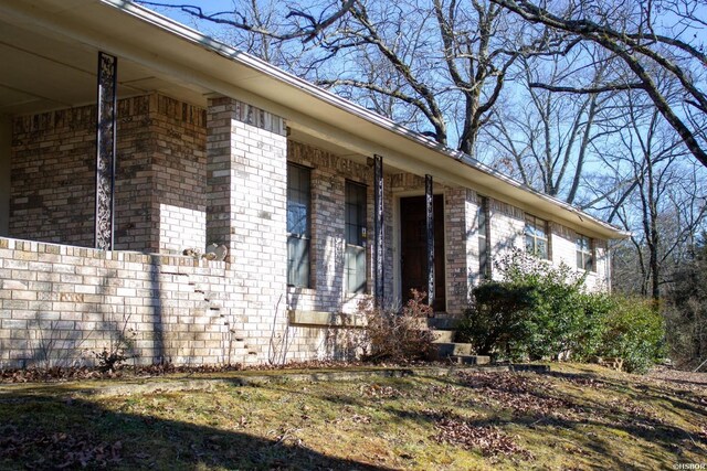 exterior space featuring brick siding