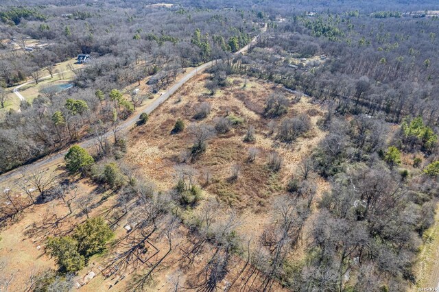 bird's eye view featuring a forest view