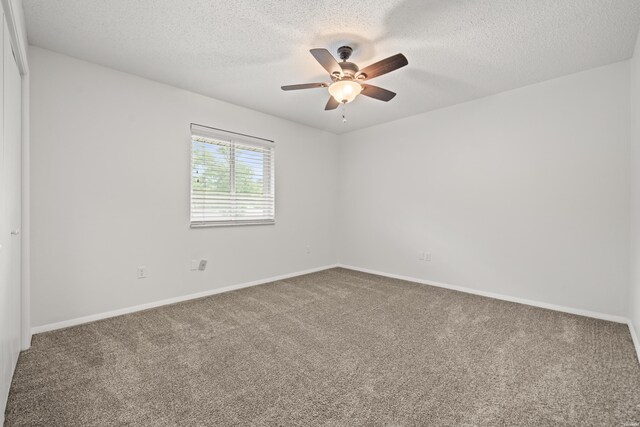 1121 Twin Points Rd Unit 1121C, Hot Springs, AR 71913 - carpeted spare room with a textured ceiling, a ceiling fan, and baseboards