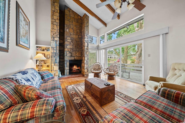 105 Long Island Bay Unit A1, Hot Springs, AR 71913 - living room featuring high vaulted ceiling, beam ceiling, wood finished floors, ceiling fan, and a fireplace