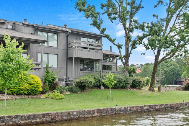 105 Long Island Bay Unit A1, Hot Springs, AR 71913 - rear view of house featuring a balcony, a water view, and a lawn