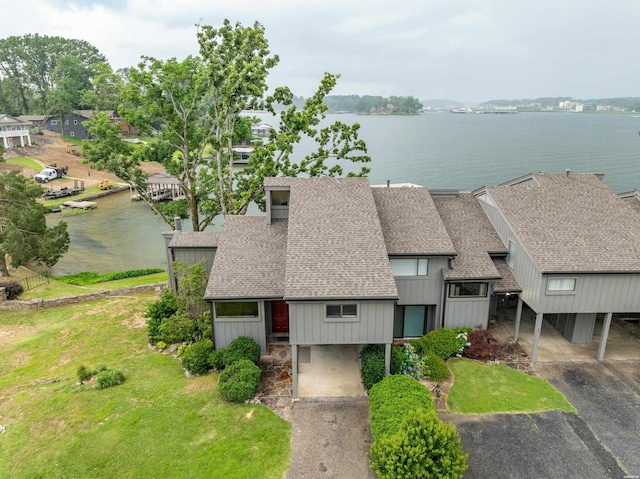105 Long Island Bay Unit A1, Hot Springs, AR 71913 - view of front facade featuring roof with shingles, a water view, and a front lawn