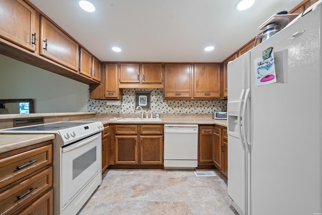 105 Long Island Bay Unit A1, Hot Springs, AR 71913 - kitchen featuring white appliances, brown cabinets, light countertops, and recessed lighting