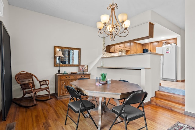 105 Long Island Bay Unit A1, Hot Springs, AR 71913 - dining space with light wood-style floors, a chandelier, and recessed lighting