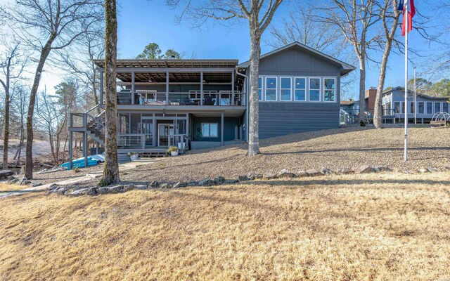 back of house featuring a balcony