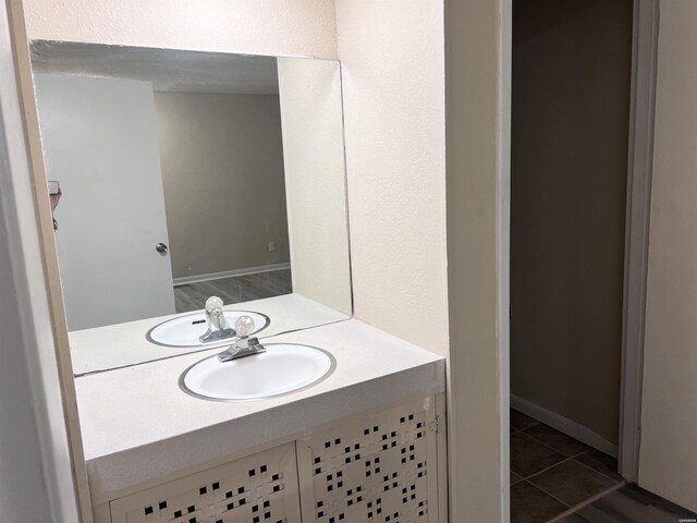 bathroom with tile patterned flooring and vanity