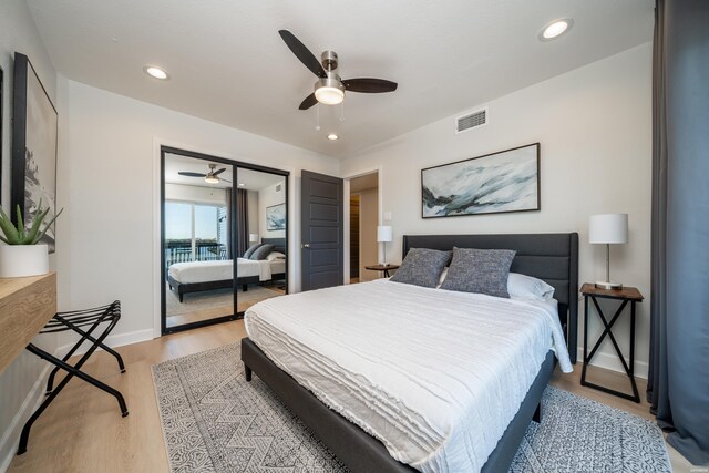 bedroom featuring baseboards, light wood-type flooring, visible vents, and recessed lighting