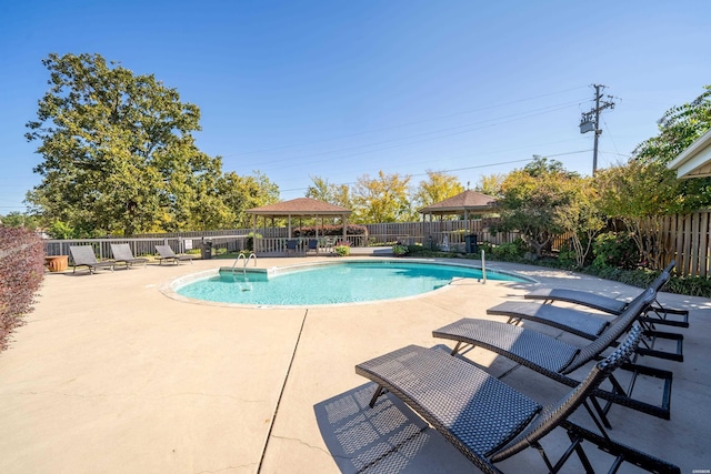 view of pool with a fenced in pool, a patio area, fence, and a gazebo