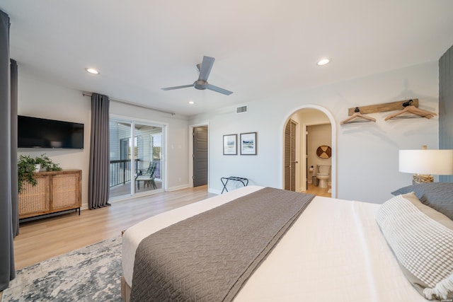 bedroom with visible vents, arched walkways, access to outside, light wood-type flooring, and recessed lighting