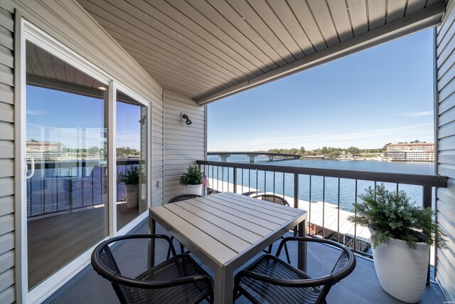 balcony featuring a water view