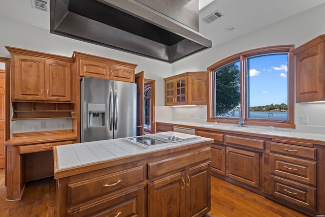 69 Resplandor Way, Hot Springs Village, AR 71909 - kitchen with range hood, visible vents, tile countertops, a sink, and appliances with stainless steel finishes