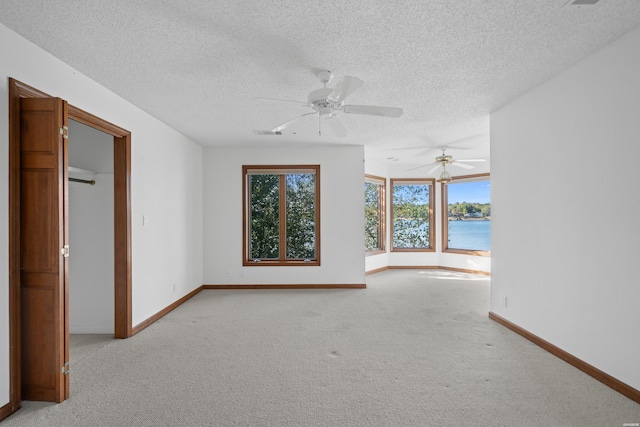 69 Resplandor Way, Hot Springs Village, AR 71909 - empty room with light colored carpet, baseboards, and a textured ceiling