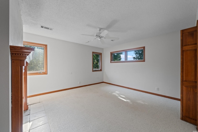 69 Resplandor Way, Hot Springs Village, AR 71909 - unfurnished room featuring visible vents, a ceiling fan, light carpet, baseboards, and a textured ceiling
