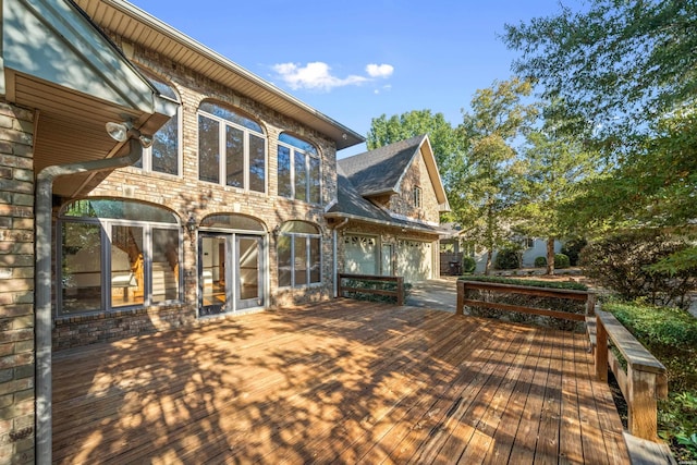 69 Resplandor Way, Hot Springs Village, AR 71909 - deck featuring an attached garage and driveway