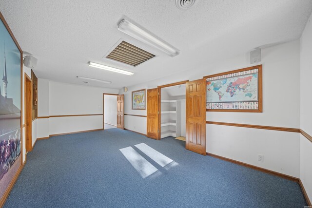 69 Resplandor Way, Hot Springs Village, AR 71909 - carpeted spare room featuring visible vents, baseboards, and a textured ceiling