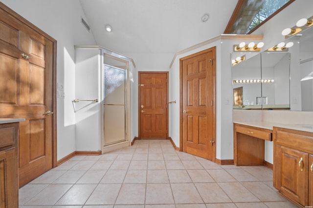 69 Resplandor Way, Hot Springs Village, AR 71909 - full bathroom with vanity, baseboards, tile patterned flooring, and a stall shower