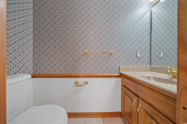 69 Resplandor Way, Hot Springs Village, AR 71909 - bathroom featuring baseboards, vanity, tile patterned floors, and toilet