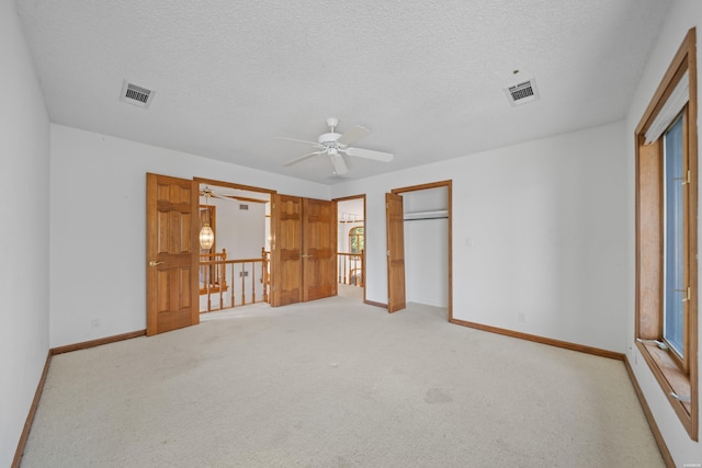 69 Resplandor Way, Hot Springs Village, AR 71909 - unfurnished bedroom featuring baseboards, visible vents, and a textured ceiling
