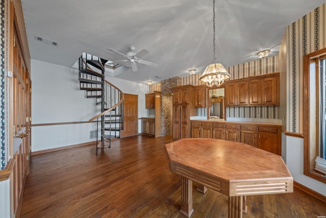 69 Resplandor Way, Hot Springs Village, AR 71909 - dining room with stairway, wallpapered walls, dark wood finished floors, baseboards, and visible vents
