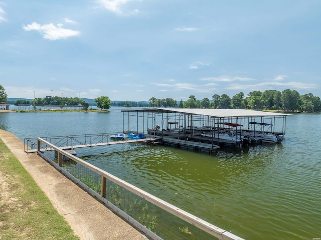 dock area with a water view and boat lift