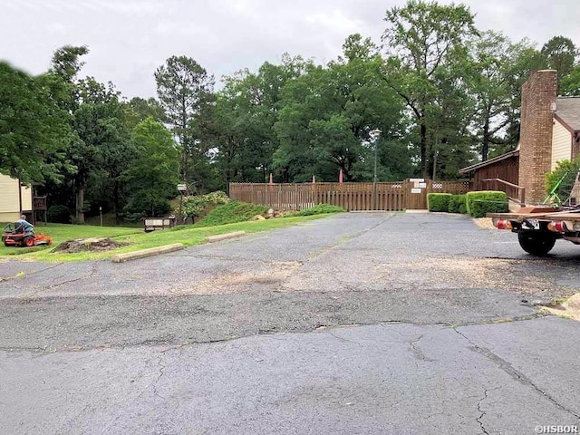 22 Huntleigh Dr, Hot Springs, AR 71901 - view of road featuring view of scattered trees and a gate