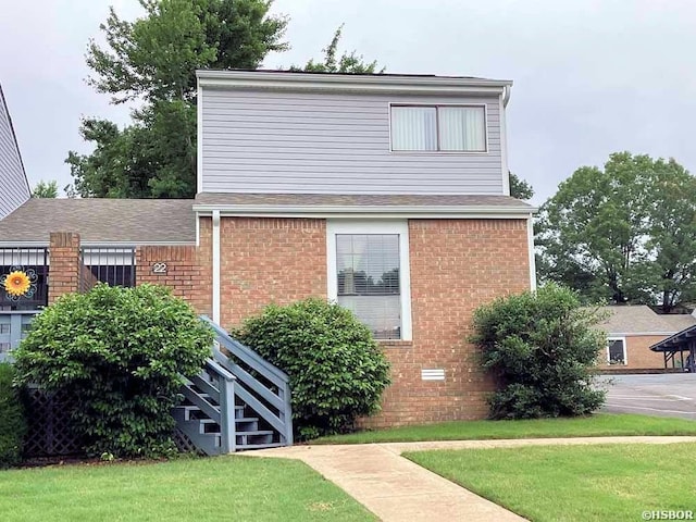 22 Huntleigh Dr, Hot Springs, AR 71901 - view of home's exterior with a yard and brick siding