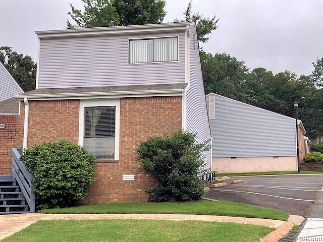 22 Huntleigh Dr, Hot Springs, AR 71901 - view of side of home featuring crawl space, uncovered parking, and brick siding