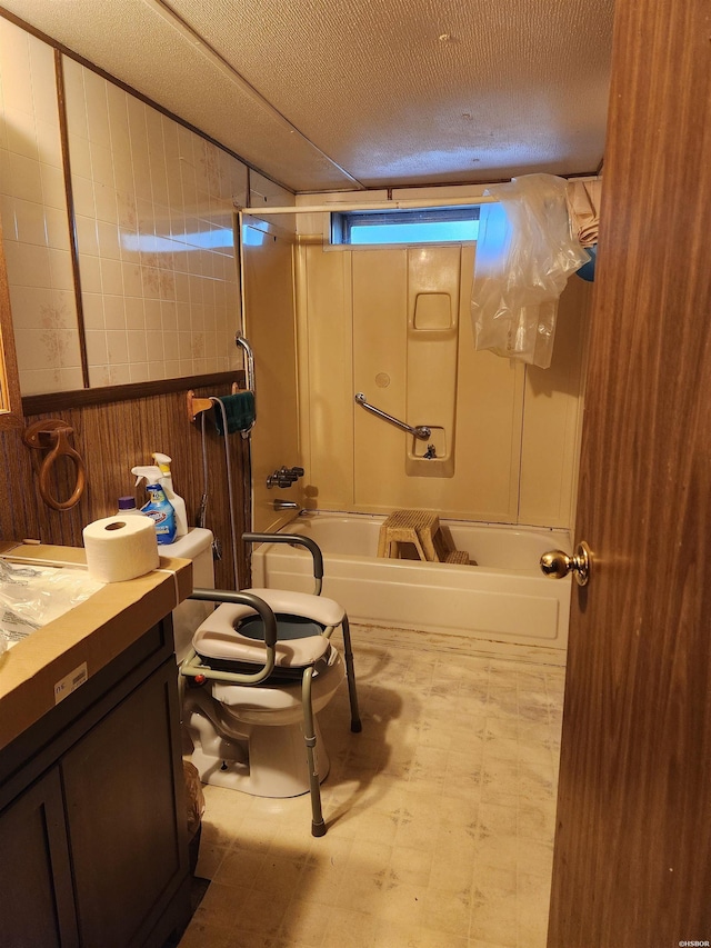 256 Shawnee Loop, Amity, AR 71921 - bathroom with vanity, tile patterned floors,  shower combination, wooden walls, and a textured ceiling