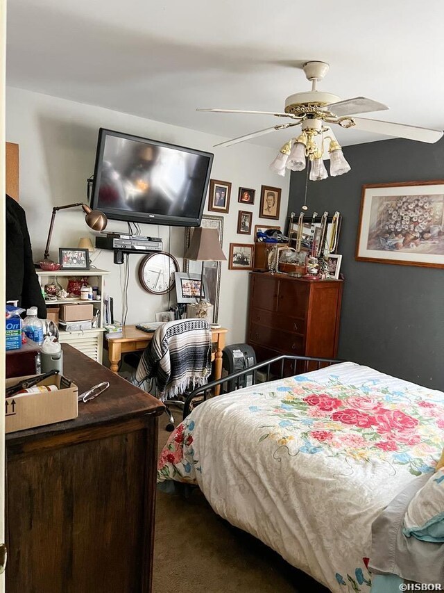 bedroom featuring ceiling fan and carpet flooring