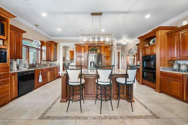 kitchen with black appliances, open shelves, decorative light fixtures, and a center island