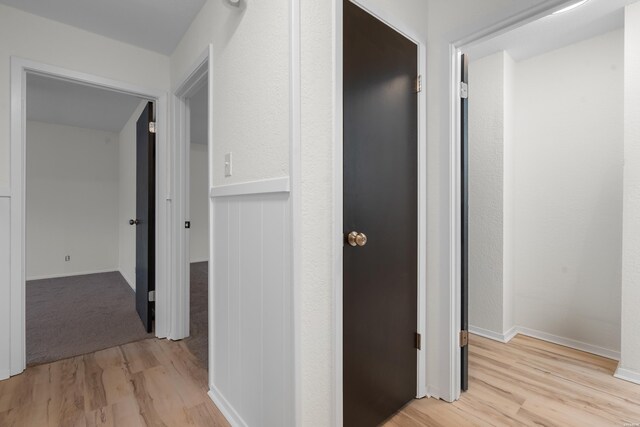 corridor with light wood finished floors