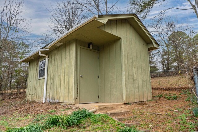 view of shed with fence