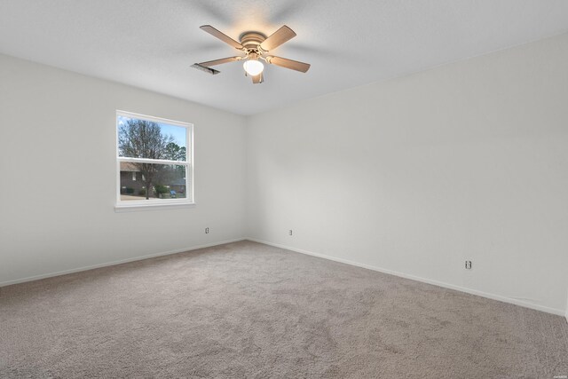 unfurnished room featuring ceiling fan, baseboards, and carpet flooring