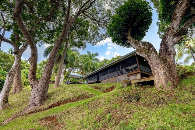 view of property exterior with a yard