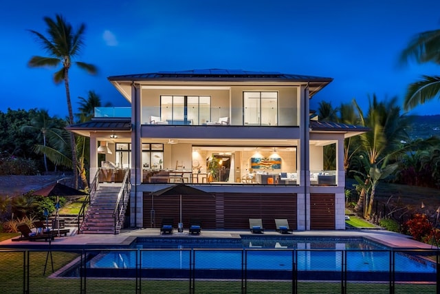 back house at night with a patio